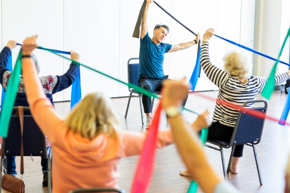 A group exercising with resistance bands
